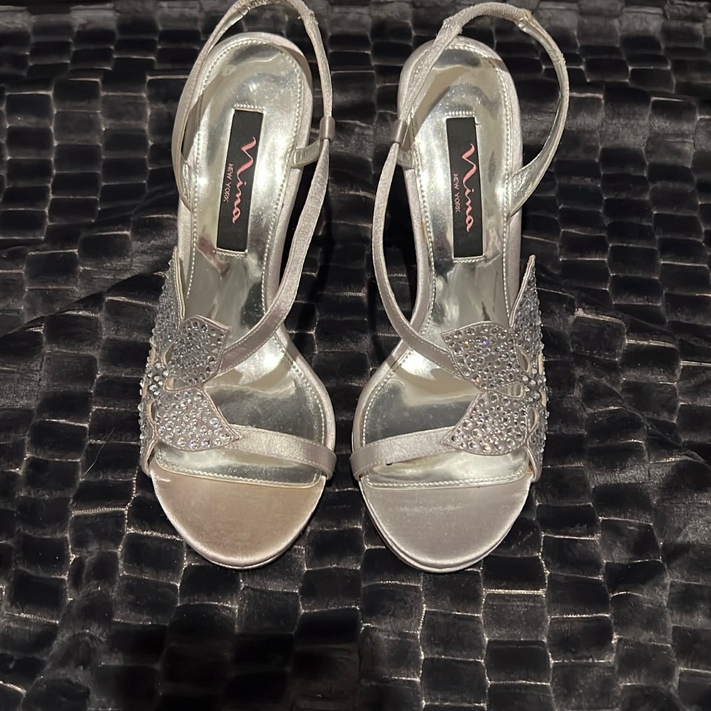 Nina silver and flutter sling back heels.